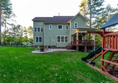 Great level back yard with stamped concrete patio 