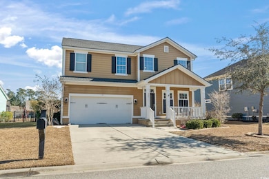 View of front of property with a garage and covere