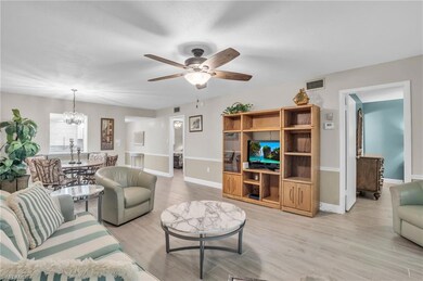 LIVING AREA LEADING OUT TO REAR SCREENED LANAI