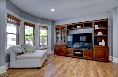 Living room with light hardwood / wood-style flooring