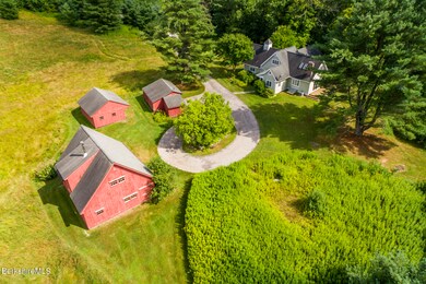 AERIAL VIEW OF HOUSE AND BARN