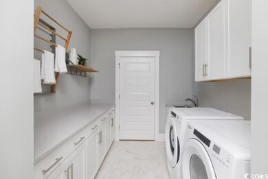 Laundry area with washer and dryer, cabinet space,