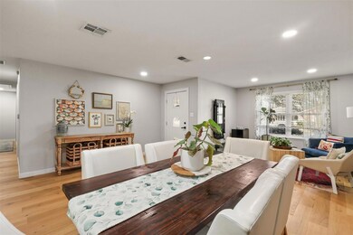 Dining area with light wood-type flooring, visible