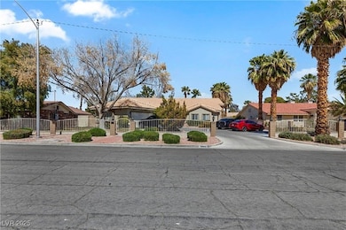 Ranch-style house featuring driveway and a tile roof