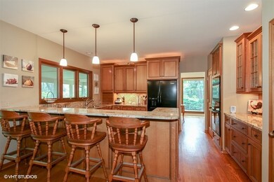 White Oak Cabinets, Granite Counters with Step-up 