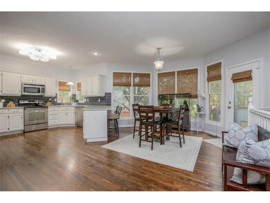 Updates begin with refinished hardwoods, flat ceil