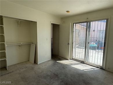 Unfurnished bedroom featuring carpet, a closet, an