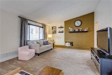 Great size living room with a lovely brick feature
