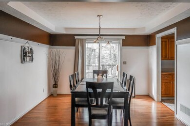 Formal dining room with a tray ceiling and sliding