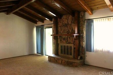 Living room with vaulted wood ceilings