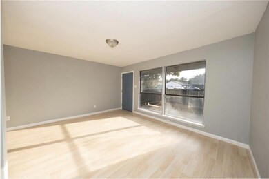 Empty room with baseboards and wood finished floo