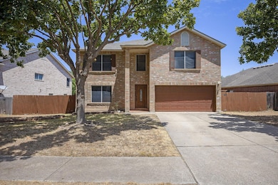 Traditional home with an attached garage, drivewa