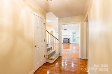 foyer with hardwood floors throughout main floor