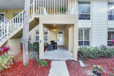 Entrance to property with a balcony and a patio