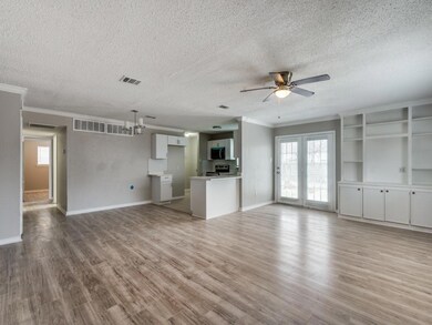 Unfurnished living room featuring light wood-style