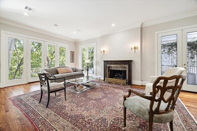 Living room with floor to ceiling windows flanking