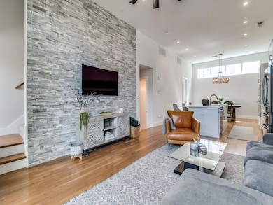 Living area with light wood-style flooring, recess
