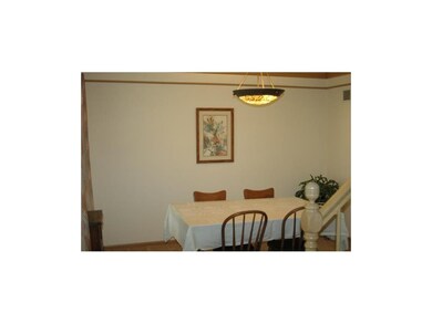Formal Dining w Gorgeous Light Fixture & Same Crow