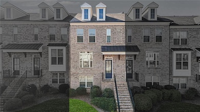 View of front of home with brick siding and stairway