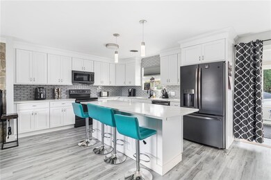 Kitchen with Stainless Steel Appliance and Open Fl