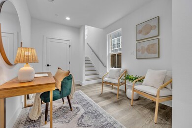Office space with baseboards, arched walkways, rec