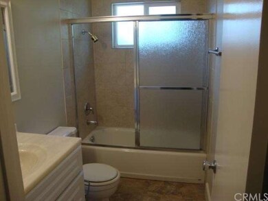 The hall bathroom features a shower over tub and i