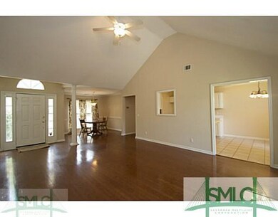 Living Room. VAULTED CEILINGS AND PEEAK-A-BOO KITC