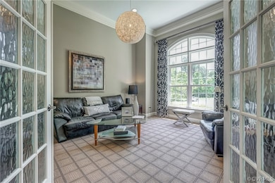 The sitting room/home office features 15 ft ceilin