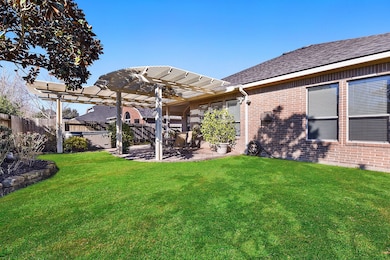 Great size backyard w/lovely landscaping.  Covered patio with added purgula and hot tub!  NEW fence being put in today!