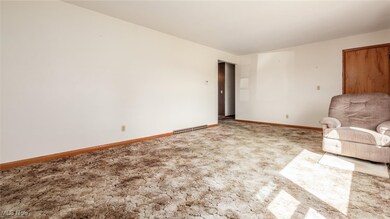 Unfurnished living room with carpet