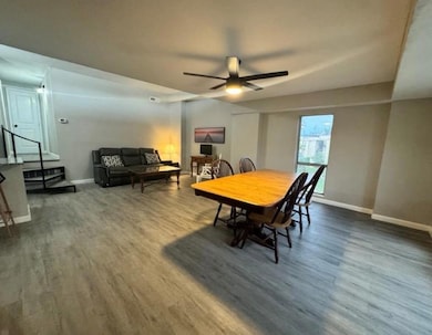 Dining space with baseboards, a ceiling fan, and 