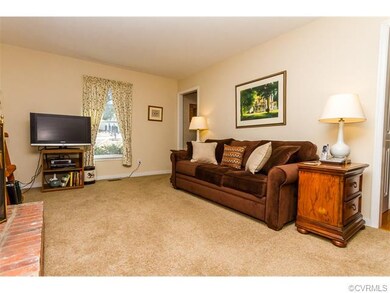 LIVING ROOM W/ BRICK FIREPLACE