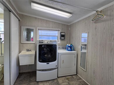 Laundry located in the Shed off the carport!