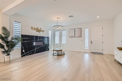 Foyer with light wood-type flooring and recessed lighting
