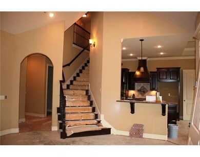Kitchen. Spectacular Grand Staircase & architectural detailing in the dooways, walls & ceilings!