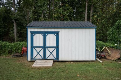 Nice size shed for storage in backyard.