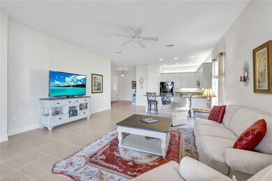 Tiled living room featuring ceiling fan