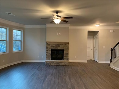Unfurnished living room with dark wood-style floor