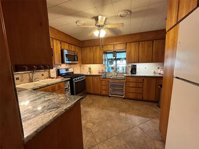 Kitchen with appliances with stainless steel finis