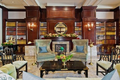 Relax by the fireplace in the elegant seating area