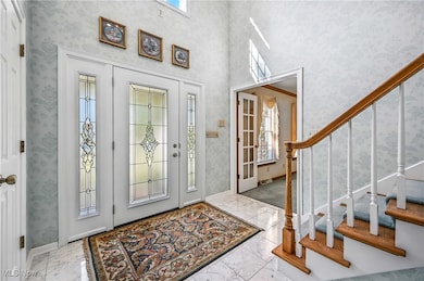 New foyer entry marble floors entry to additonal living space
