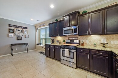 Kitchen boasts loads of cabinets and counter space.