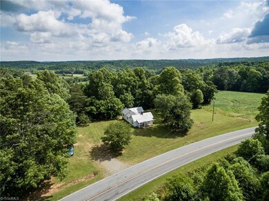 1935 fixer upper farm house on approx. 11 acres on Joe Layne Mill Road in Yadkin Valley wine country.