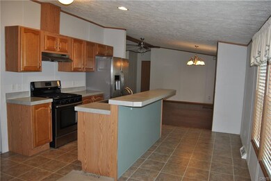 Kitchen w/ Island & SS Appliances