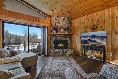 Notice the Tongue and Groove ceilings, gas fireplace, stone accents, and wall of glass. Each provides grand focal points.