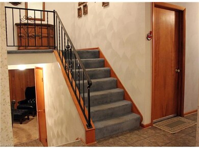 Stairs, up to bedrooms, down to family room