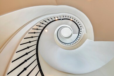 Dramatic spiral staircase leading to all four floo