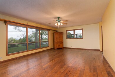 Large Window and Harwood Floors