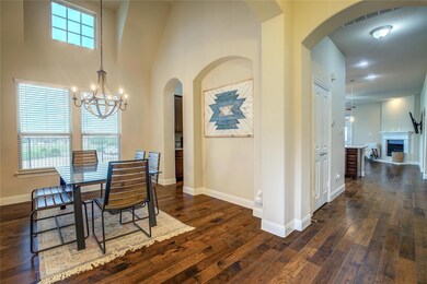 Dining Room With A Butler's Pantry Leading Into The Kitchen. Hardwood / Wood-Style Flooring, And High Ceilings.