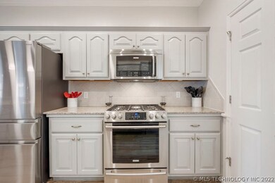 Kitchen features stainless steel appliances